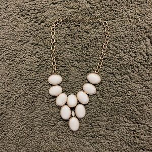 gold and white necklace